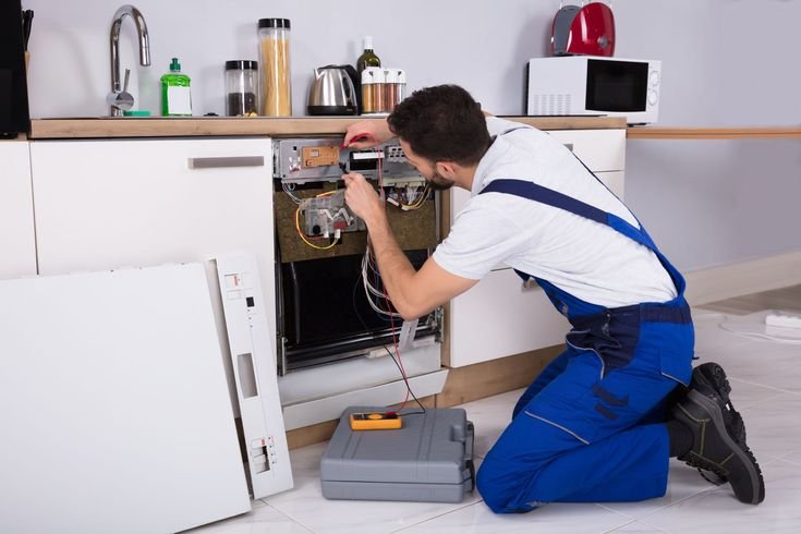 Appliance Repair Service technician repairs dishwasher